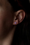 Model wearing amethyst stud earrings