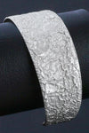 Silver textured lunar surface cuff bangle